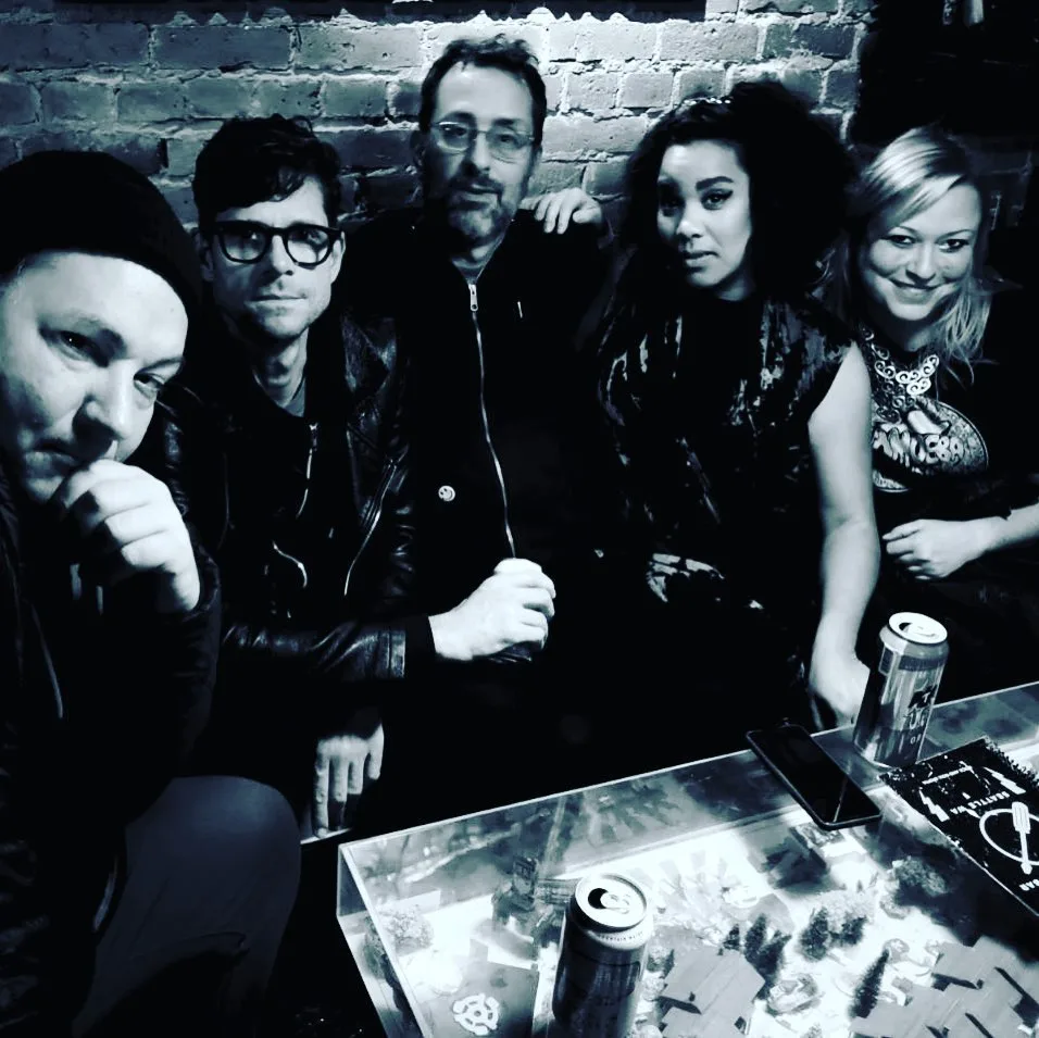 Group Photo On Couch In Bar Before Show.